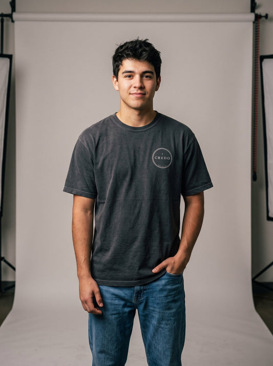 Credo — I Believe Tee, front. Credo seal on the left chest.